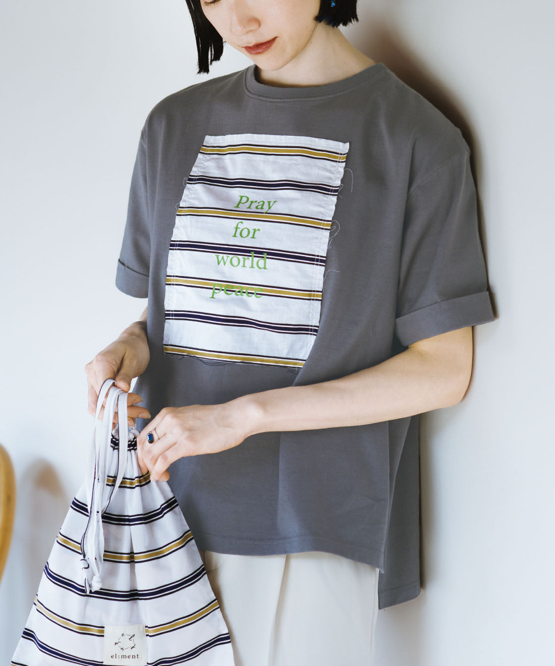 el:ment|el：ment 眠っていた播州織に平和の言葉をのせたオーガニックコットンTシャツ〈きんちゃく付き〉 by LOVE＆PEACE PROJECT